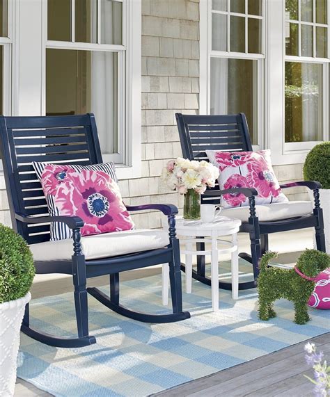 rocking chairs sitting  top   blue  white rug
