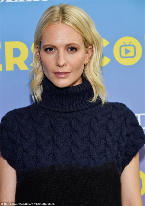 poppy delevingne turns heads in bold colour block jumper