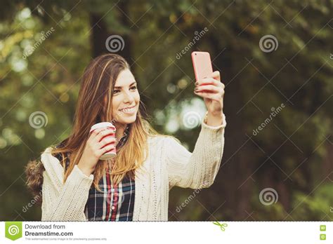 woman with a cup selfie