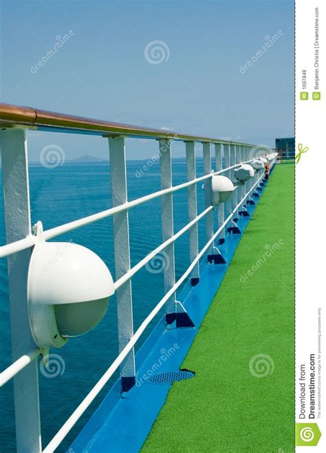 wooden handrail  cruise ship deck  sea stock photo