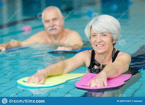 Active Senior Doing Aqua Gym In Outdoor Swimming Pool Stock Image