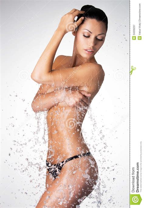 Beautiful Naked Woman With Wet Body And Splashes Of Water