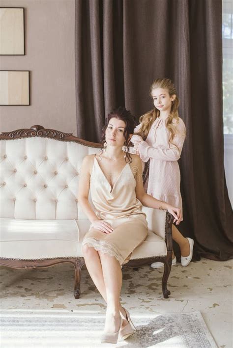 Lovely And Elegant Mother And Daughter In Beautiful Fashionable