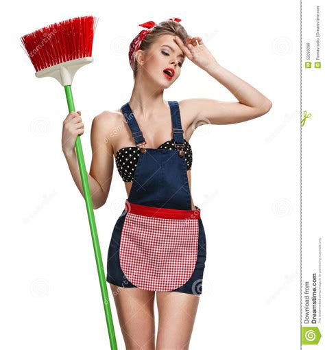 Tired Maid Standing After Spring Cleaning With Broom Stock