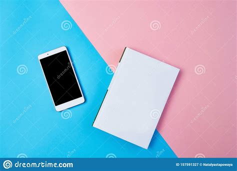 mockup flat lay composition  smartphone  notepad   blue  pink background stock