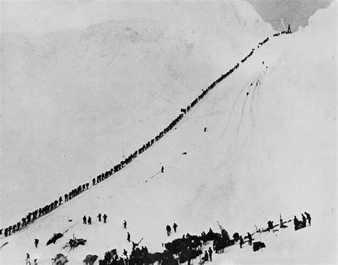 klondike gold rush prospectors climbing  chilkoot trail carrying   gear