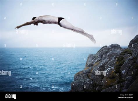 man diving  cliff stock photo alamy