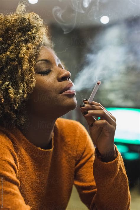 Brazilian Woman Smoking A Cigarette At Home By Mauro Grigollo