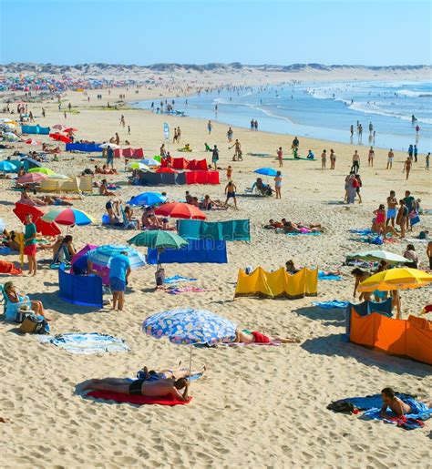 people rest ocean beach portugal editorial image image  beautiful beach