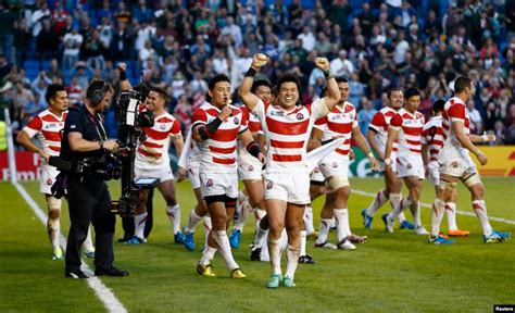 japan celebrates stunning rugby win  south africa