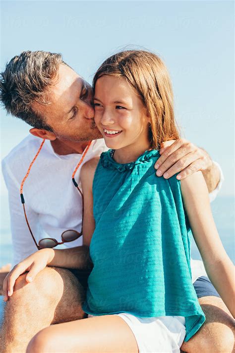 Father Kissing His 10 Years Old Daughter By Stocksy Contributor