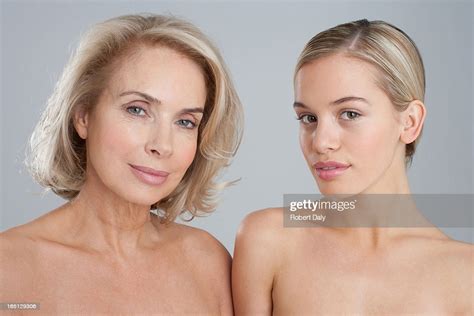 Portrait Of Smiling Bare Chested Mother And Daughter High