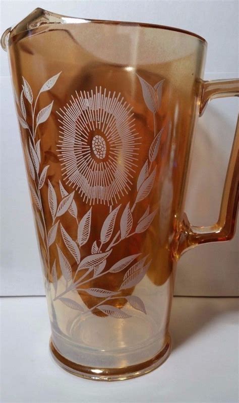 Jeanette Marigold Carnival Glass Pitcher White Flowers Iridescent