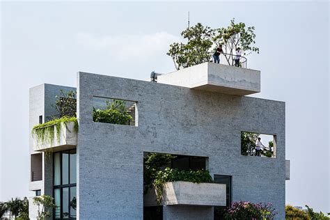 gorgeous concrete house  stacked  courtyard gardens curbed