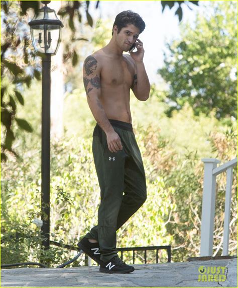 Tyler Posey Goes Shirtless As He Works On His Motorcycle Photo