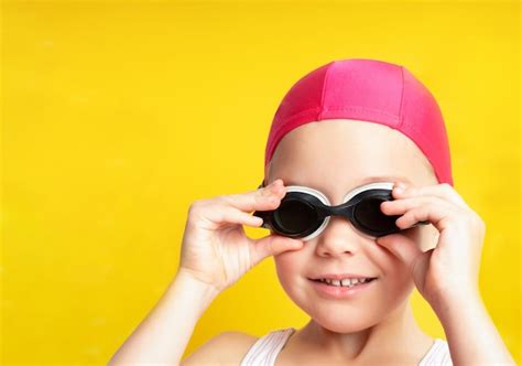 Premium Photo Portrait Of A Young Girl In Goggles And Swimming Cap