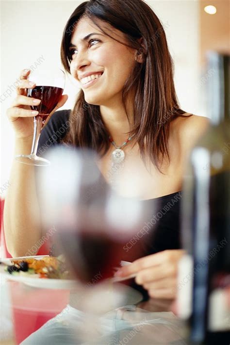 Woman Drinking Wine With Dinner Stock Image F006 3522