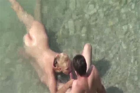 Blondie On The Nude Beach Gives Blowjob To Her Man Video