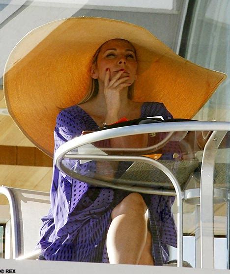 kim cattrall the big hat and an even bigger hunk