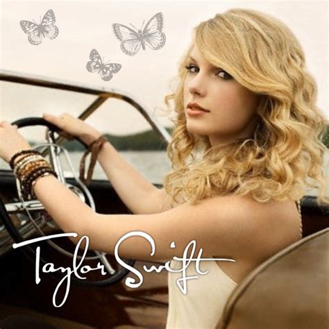 Taylor Swift Sitting In The Driver S Seat Of A Car With Butterflies
