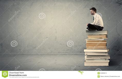 student sitting  stack  books stock photo image  business