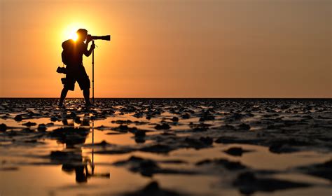photographer photography landscape water sun sunset camera