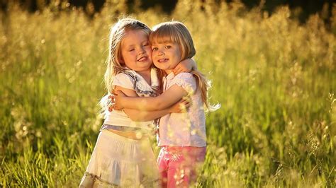 sisters embrace   camera play  stock footage sbv