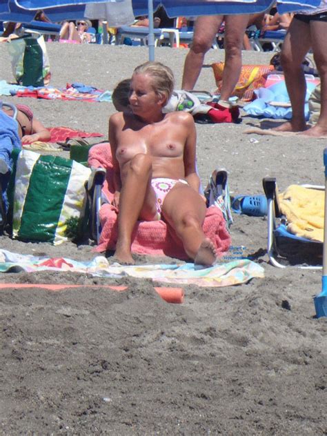 topless blonde relaxing well at beach july 2014 voyeur web hall of fame
