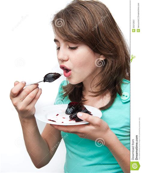 funny teen girl eating charlotte isolated on white stock