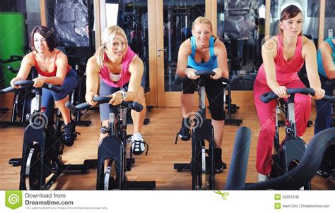 Beautiful Woman Doing Exercise In A Spinning Class Royalty