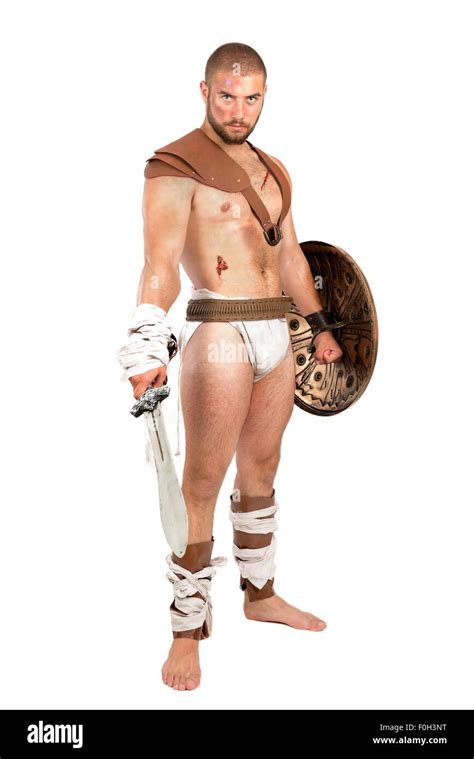 Gladiator Posing With Shield And Sword Isolated In White