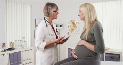 Happy Doctor Talking With Pregnant Woman Stock Footage