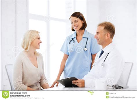 Doctor And Nurse With Patient In Hospital Royalty Free