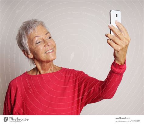 Mature Woman Taking A Selfie With Smartphone A Royalty