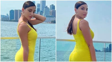 Nora Fatehi In A Sexy Yellow Figure Hugging Dress Poses For Sun Kissed