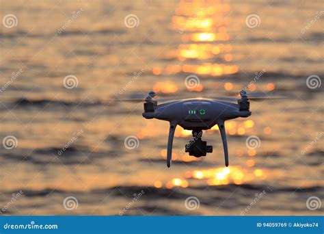 remote controlled drone flying sparkle sunlight  sea editorial stock image image