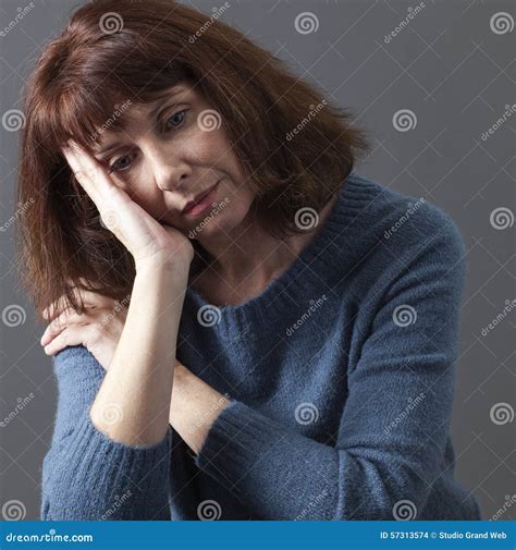 beautiful aging woman suffering  winter blues stock photo image
