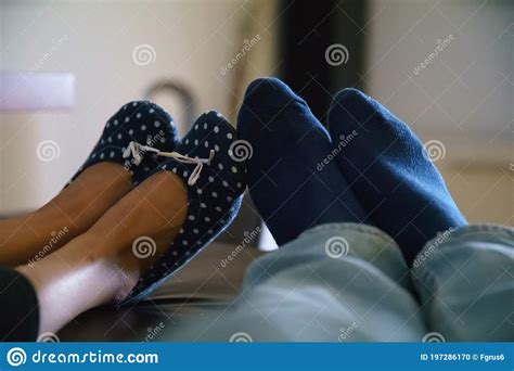 loving feed   people  couch stock photo image  footwear