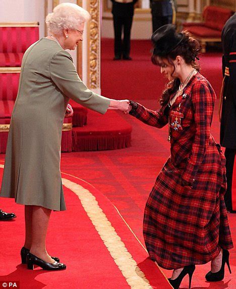 helena bonham carter picks up a cbe from her daughter the queen daily mail online