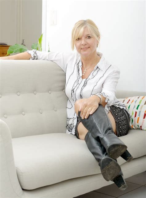 Blond Mature Woman Relaxing In Sofa Stock Image Image Of Interior