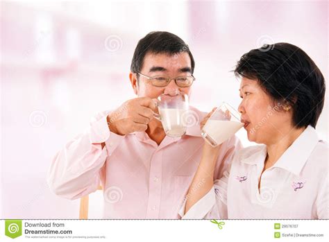 asian mature couple drinking soy milk stock image image of holding mother 29576707