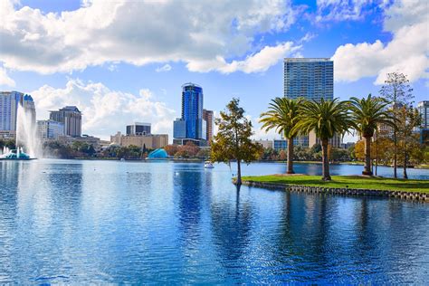 orlando skyline fom lake eola  florida usa  palm trees yacht