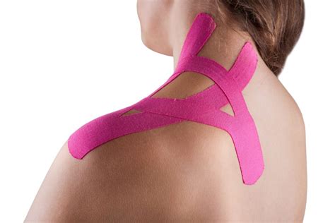 woman with kinesio tape on her left shoulder and neck