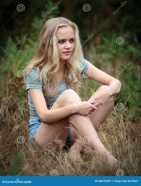Pretty Blond Teenager Sitting In The Grass Stock Image Image Of Bare