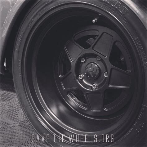 rims  tires   car  shown   black  white photo