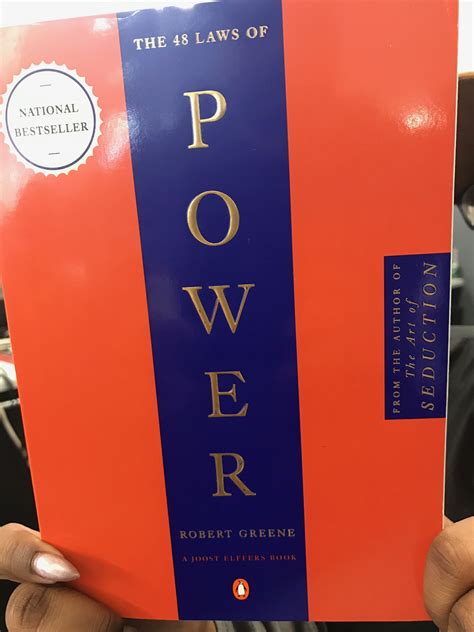 person holding   book   titlepowerin front