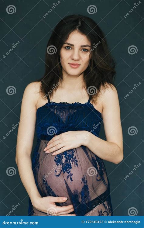 Pregnancy Pregnant Young Caucasian Brunette Girl In A Peignoir Hold