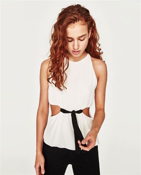 zara s side slit top 26 is a sexier piece to pair with tight pants