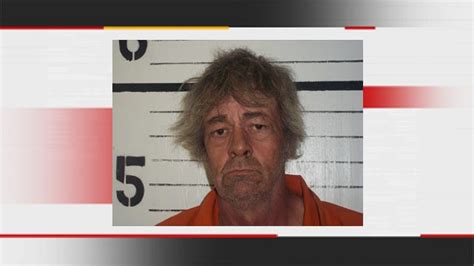 police muskogee man holds pay for sex sign at school