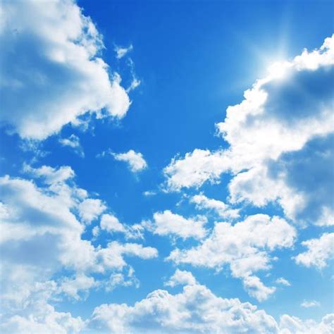 Blue Sky With Clouds And Sun Photographic Print